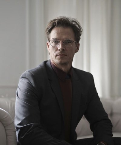 well dressed businessman sitting on sofa.jpg